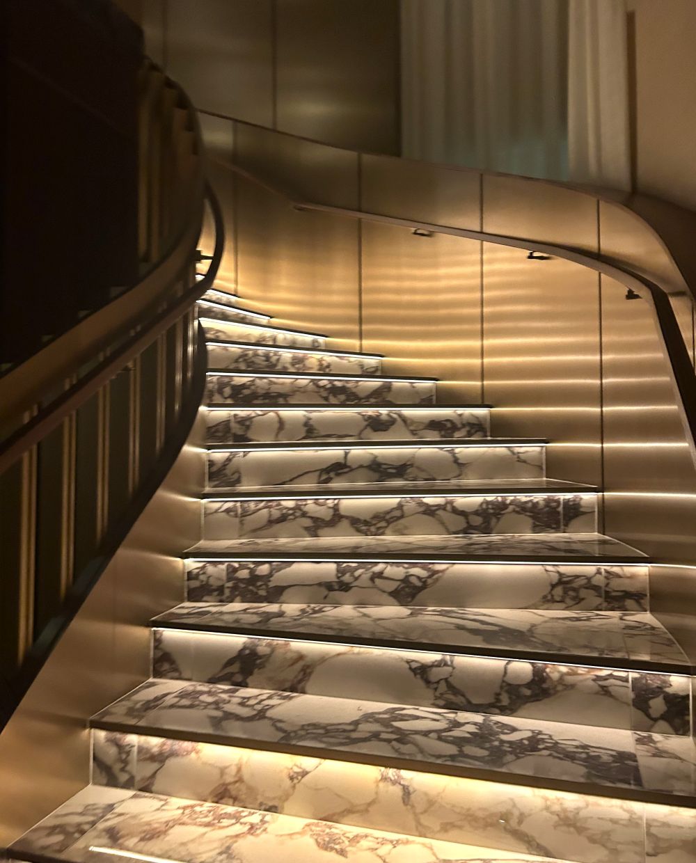 Elegant marble staircase with chic modern design inside the new 1587 Prime Steakhouse.