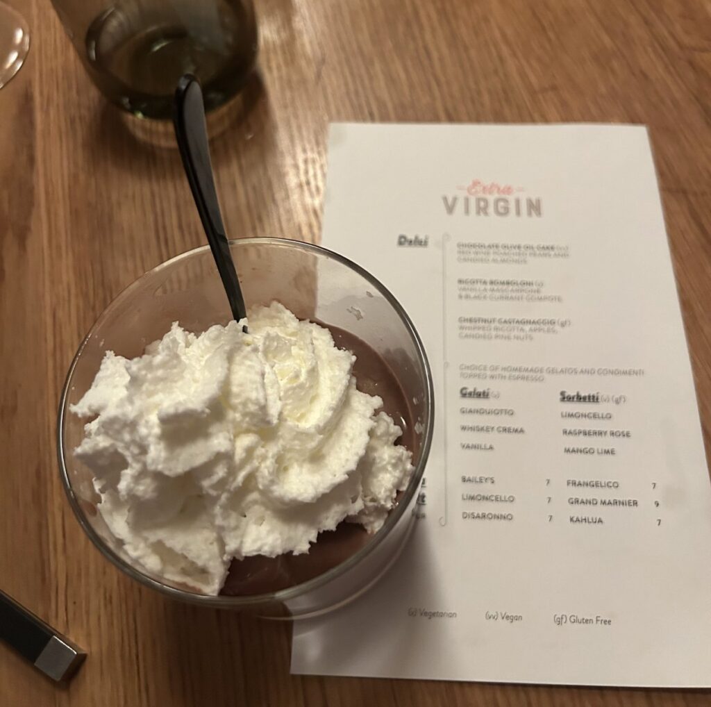 Extra Virgin is an Italian restaurant onboard Virgin Voyages’ Scarlet Lady, a luxury cruise ship.