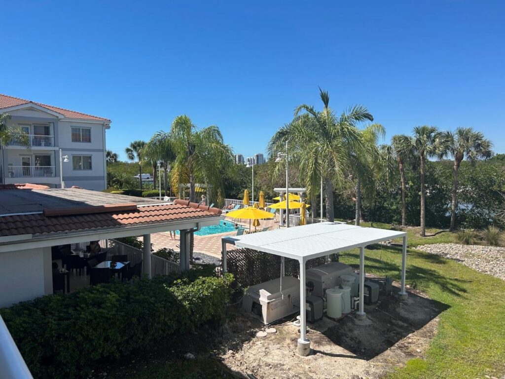 Exterior view of DoubleTree Suites by Hilton Hotel Naples with tropical landscaping