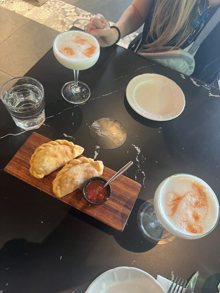 Beautifully plated Argentine food in a warm, theatrical setting at Aljibe Tango