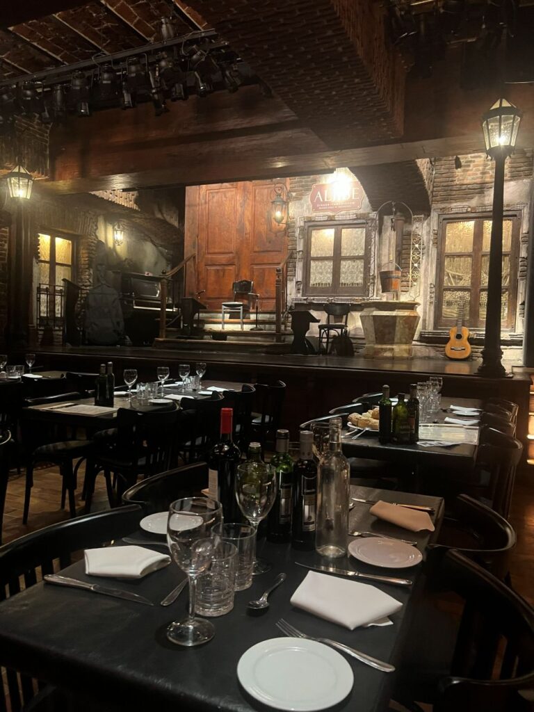 Intimate dining atmosphere with wine and local dishes at Aljibe Tango