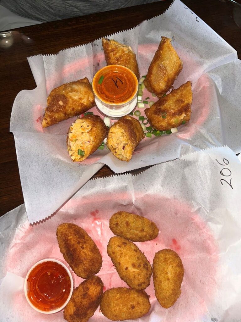 buffalo chicken egg rolls served with hot sauce and bleu cheese at Buffalo Chips Restaurant