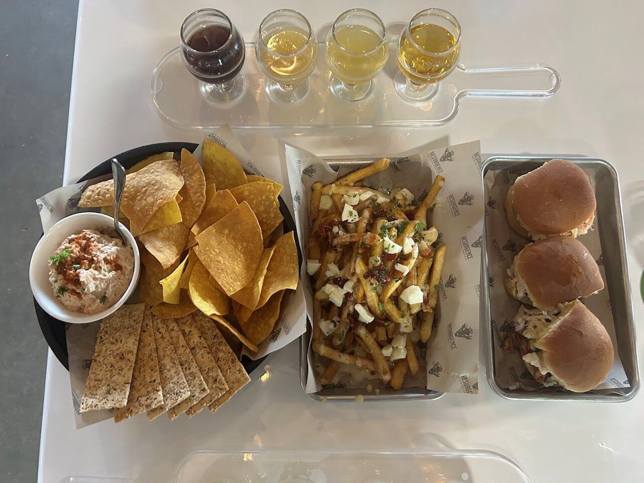A platter of chips, fries and burgers served at Resurgence Brewing Co. in Fort Myers, Florida