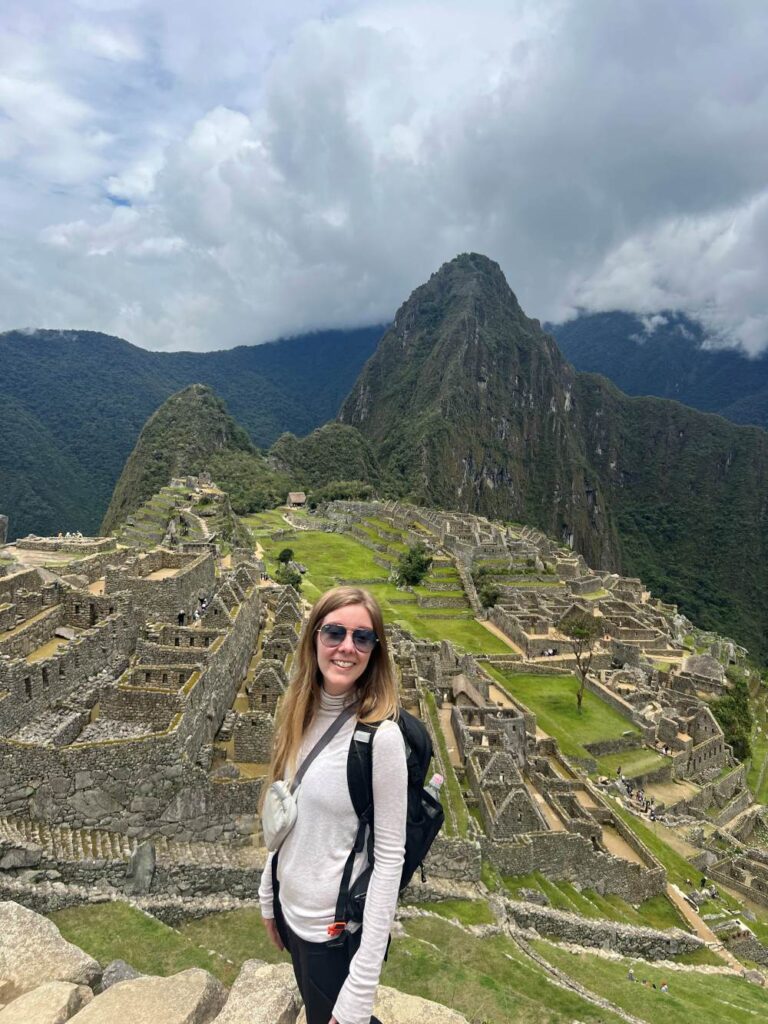 Walking through ancient stone terraces at Machu Picchu during a day trip