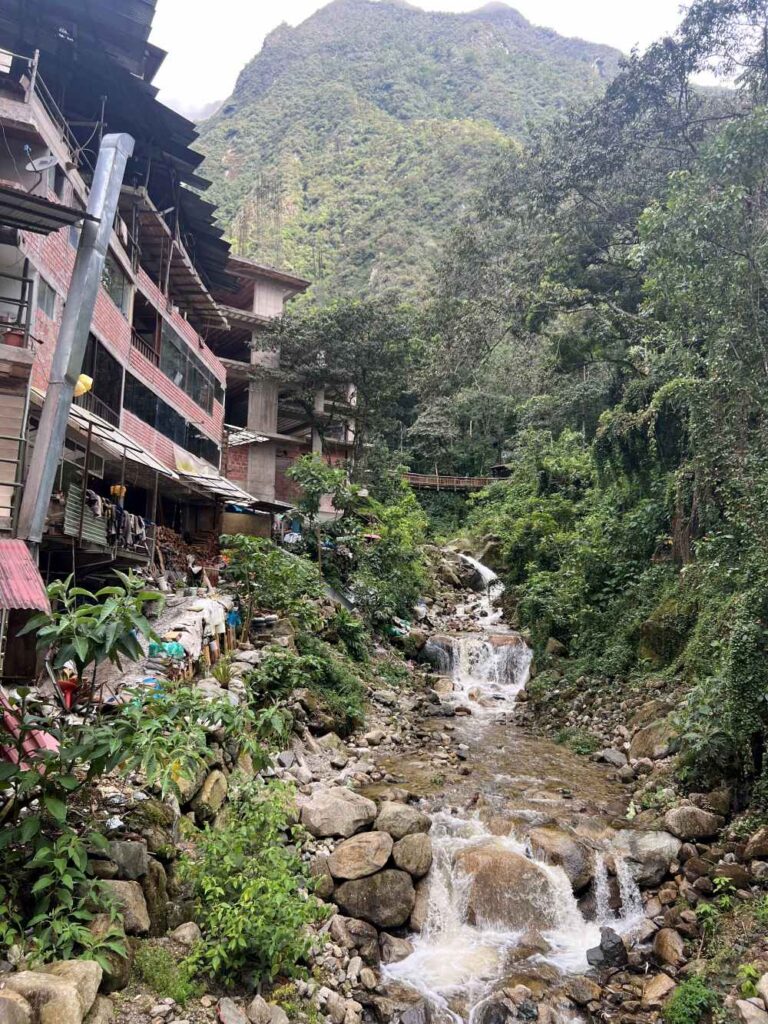 Bustling streets of Aguas Calientes filled with shops, cafés, and travelers