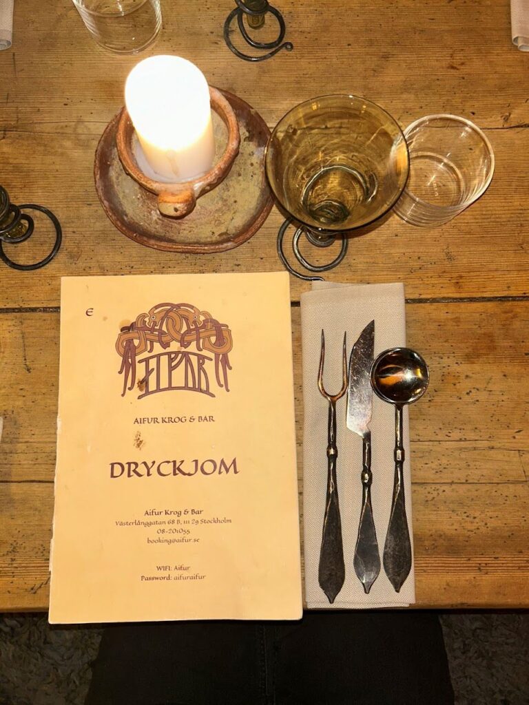 Viking-inspired dining hall inside Aifur Krog & Bar with rustic wooden interiors