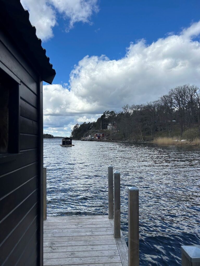 Wood-fired floating sauna experience in the scenic Stockholm Archipelago.