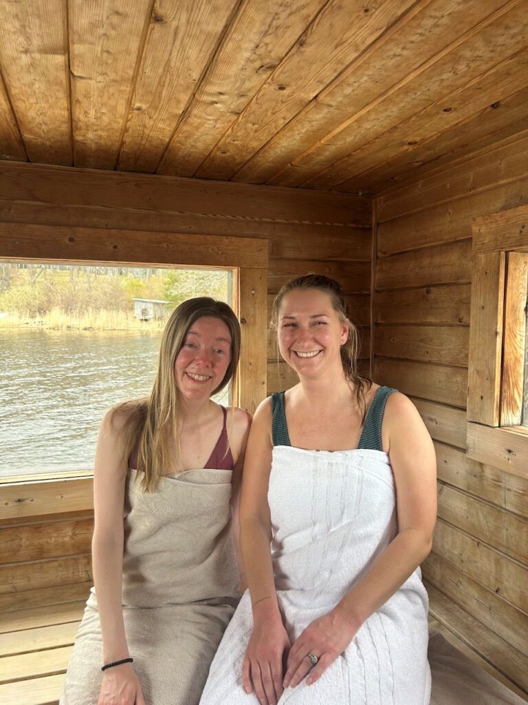 Travelers relaxing in the wood-fired floating sauna before taking a plunge in the Swedish sea.
