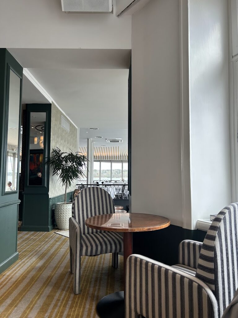 Historic Swedish hotel lounge at Waxholms Hotell with copper tables and cozy seating