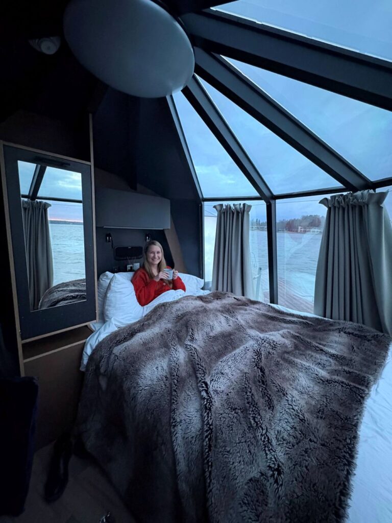 A traveler staying as a guest in an igloo at Hilton Helsinki Kalastajatorppa