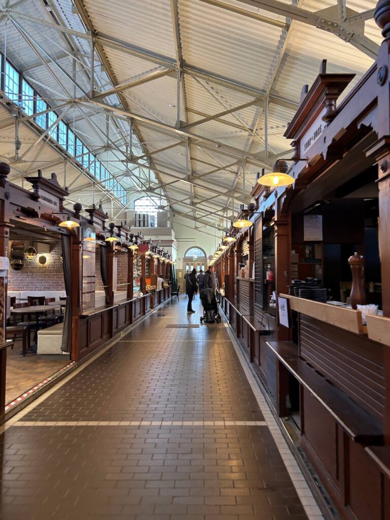 Bustling waterfront atmosphere at Market Square with food stalls and local vendors