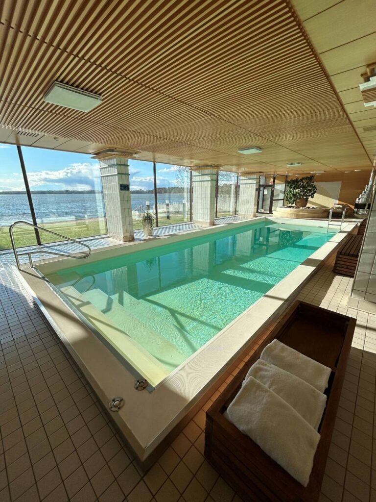 Indoor swimming pool at Hilton Helsinki Kalastajatorppa with relaxing waterfront atmosphere