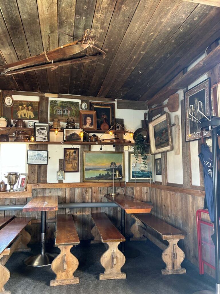 Quaint interior of Café Regatta filled with vintage furnishings and Nordic character