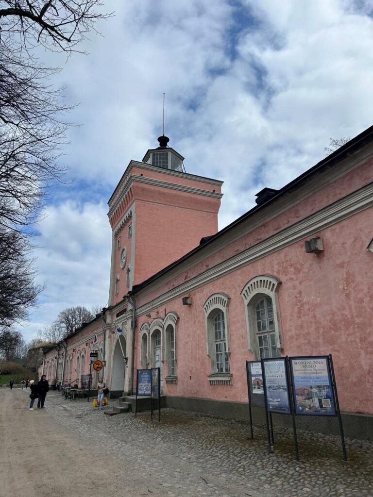 Fortress walls and grassy embankments at Suomenlinna Fortress showcasing military history