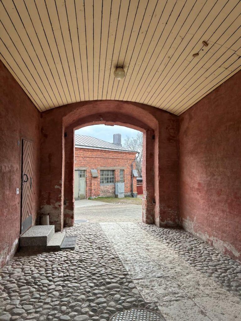 Walking along fortress paths at Suomenlinna surrounded by history