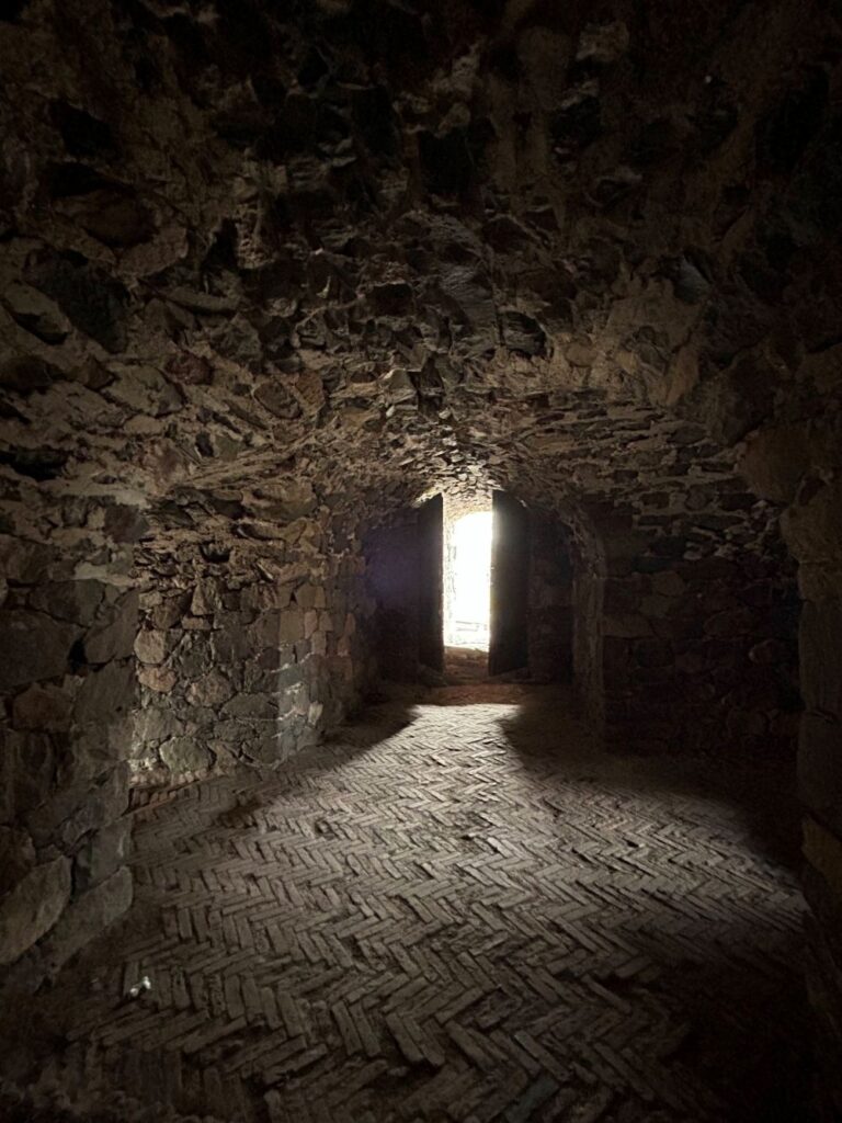 Historic stone tunnel inside Suomenlinna Fortress showcasing centuries of military history