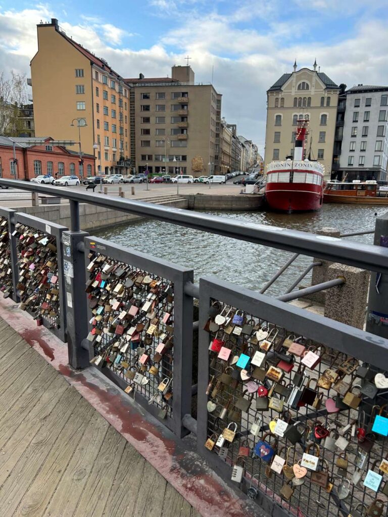 Waterfront promenade in Helsinki decorated with colorful love locks overlooking the harbor