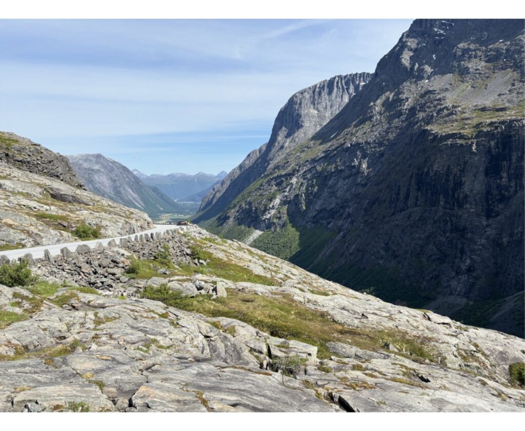 Panoramic view from Dalsnibba overlooking snow-capped mountains and deep valleys
