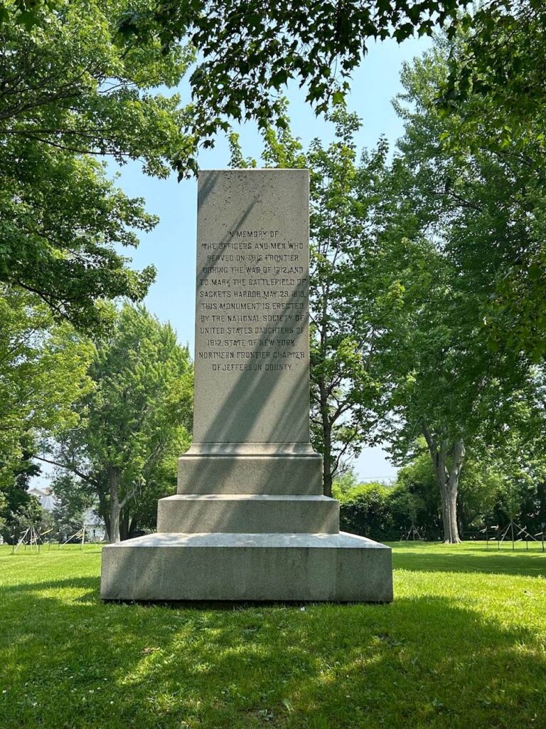 Historic battlefield grounds at Sackets Harbor Battlefield State Historic Site overlooking Lake Ontario