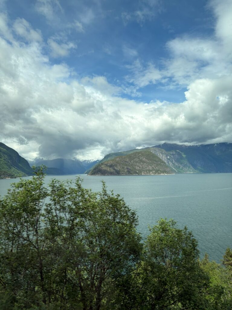 Panoramic views of lakes, mountains, and open tundra across the Hardangervidda on a Norway sightseeing tour