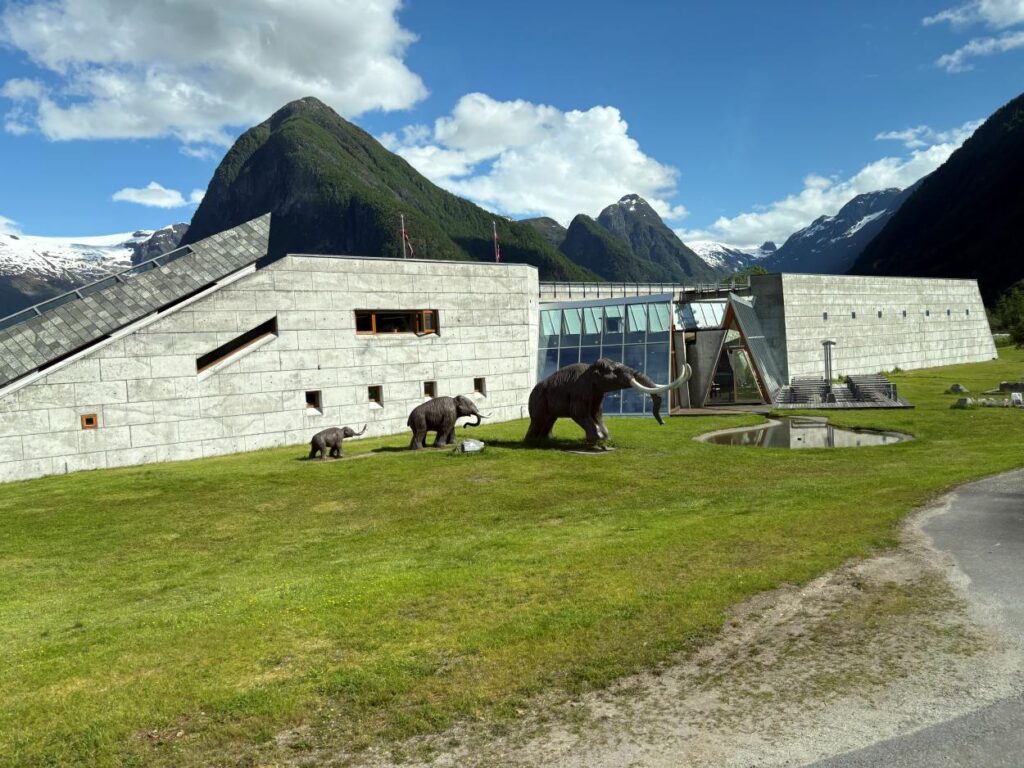 Contemporary museum building nestled between mountains at Norwegian Glacier Museum