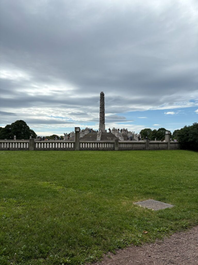 The famous Monolith sculpture towering over Frogner Park in Oslo, a popular attraction.