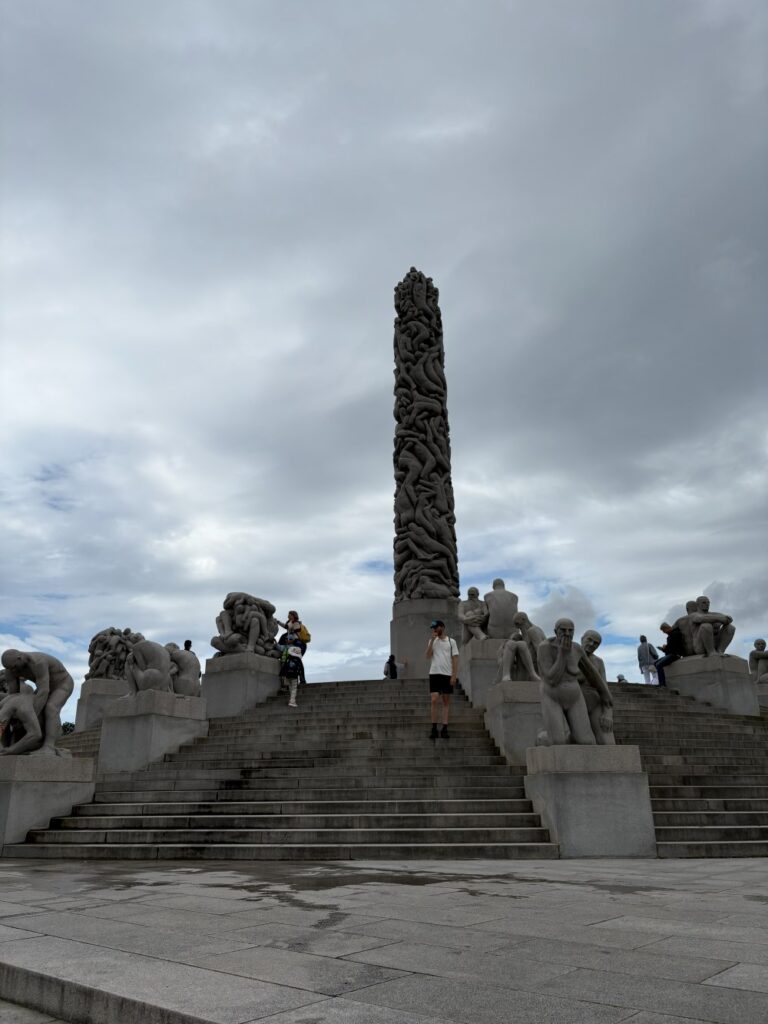 The famous Monolith sculpture towering over Frogner Park in Oslo, a popular attraction.