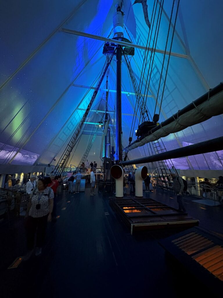 Historic polar exploration ship displayed inside Oslo's Fram Museum.