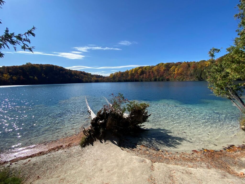 Scenic walking trails around Green Lakes State Park during peak fall foliage near Syracuse.