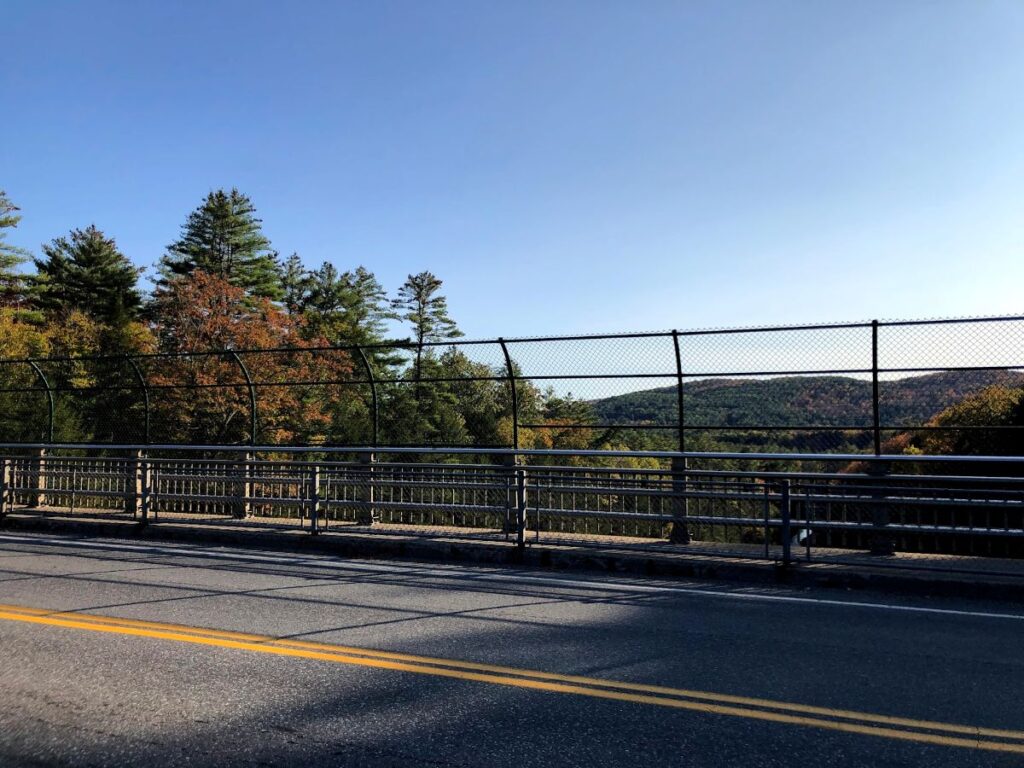 Scenic Quechee landscape with colorful fall trees and peaceful countryside during Vermont in Fall