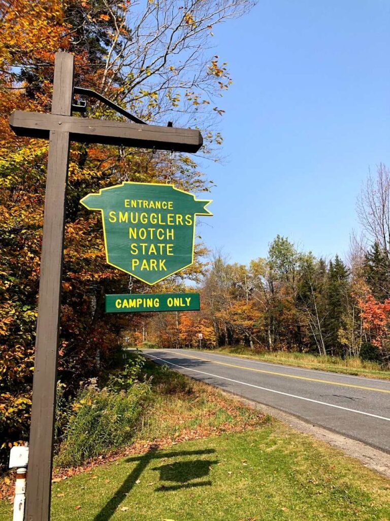Smugglers’ Notch State Park surrounded by vibrant autumn foliage during Vermont in Fall