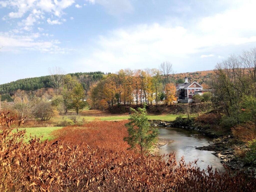 Charming Stowe village surrounded by colorful autumn foliage during Vermont in Fall