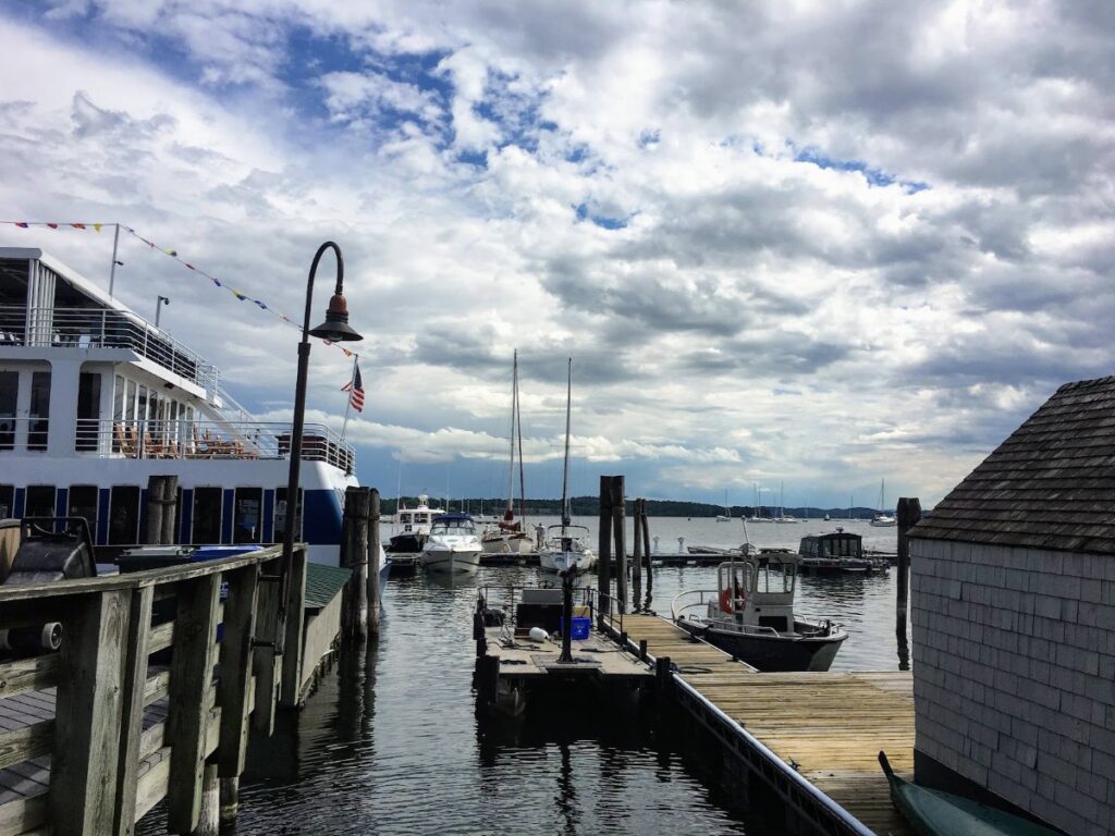 Burlington waterfront on Lake Champlain during Vermont in Fall with colorful autumn trees and scenic mountain views