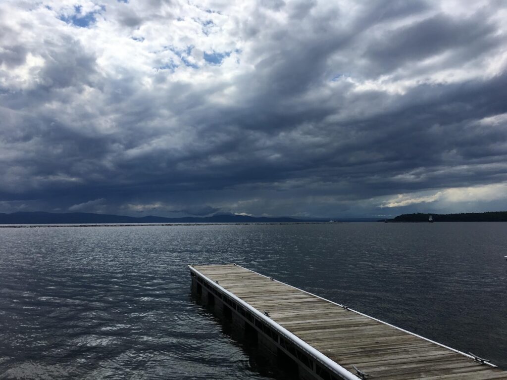 Scenic Lake Champlain waterfront and Adirondack Mountains seen from Burlington in Vermont in Fall