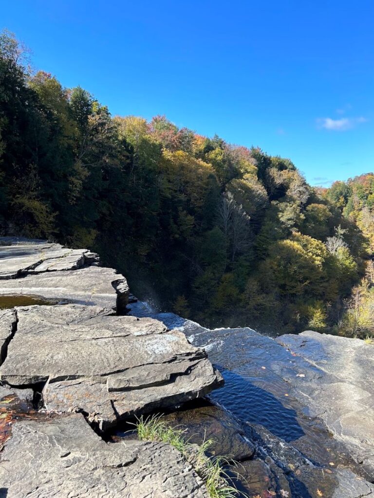 Salmon River Falls surrounded by vibrant autumn foliage near Syracuse.