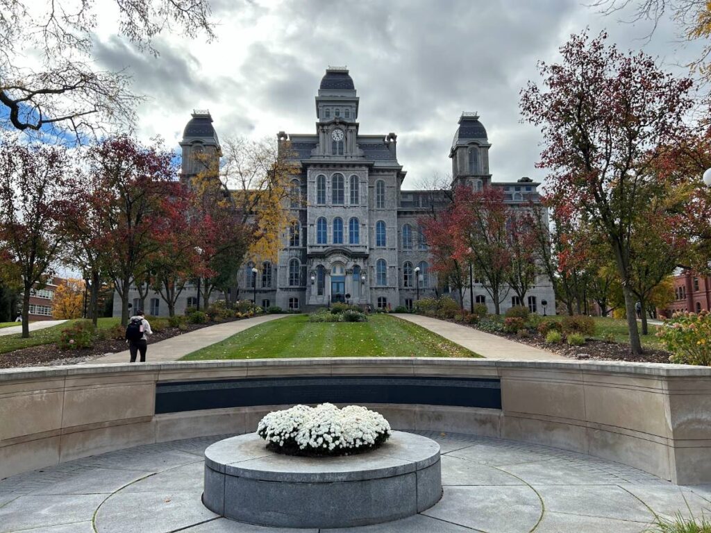 Fall foliage surrounding historic buildings at Syracuse University.