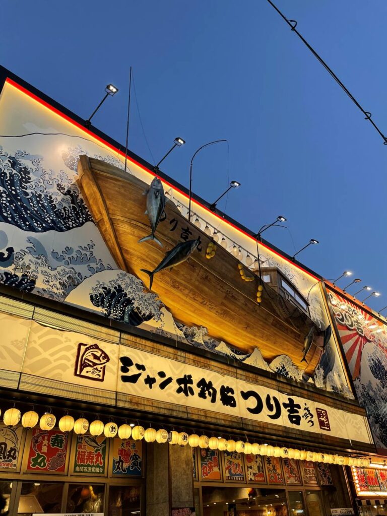 Exploring Shinsekai in Osaka, Japan, with vibrant streets, local eateries, and the famous Tsutenkaku Tower
