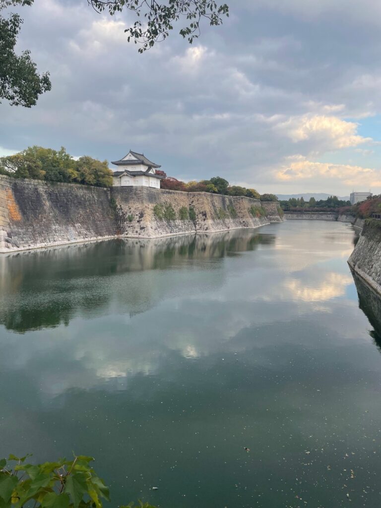 Osaka Castle tower overlooking the surrounding city and castle grounds in Osaka, Japan