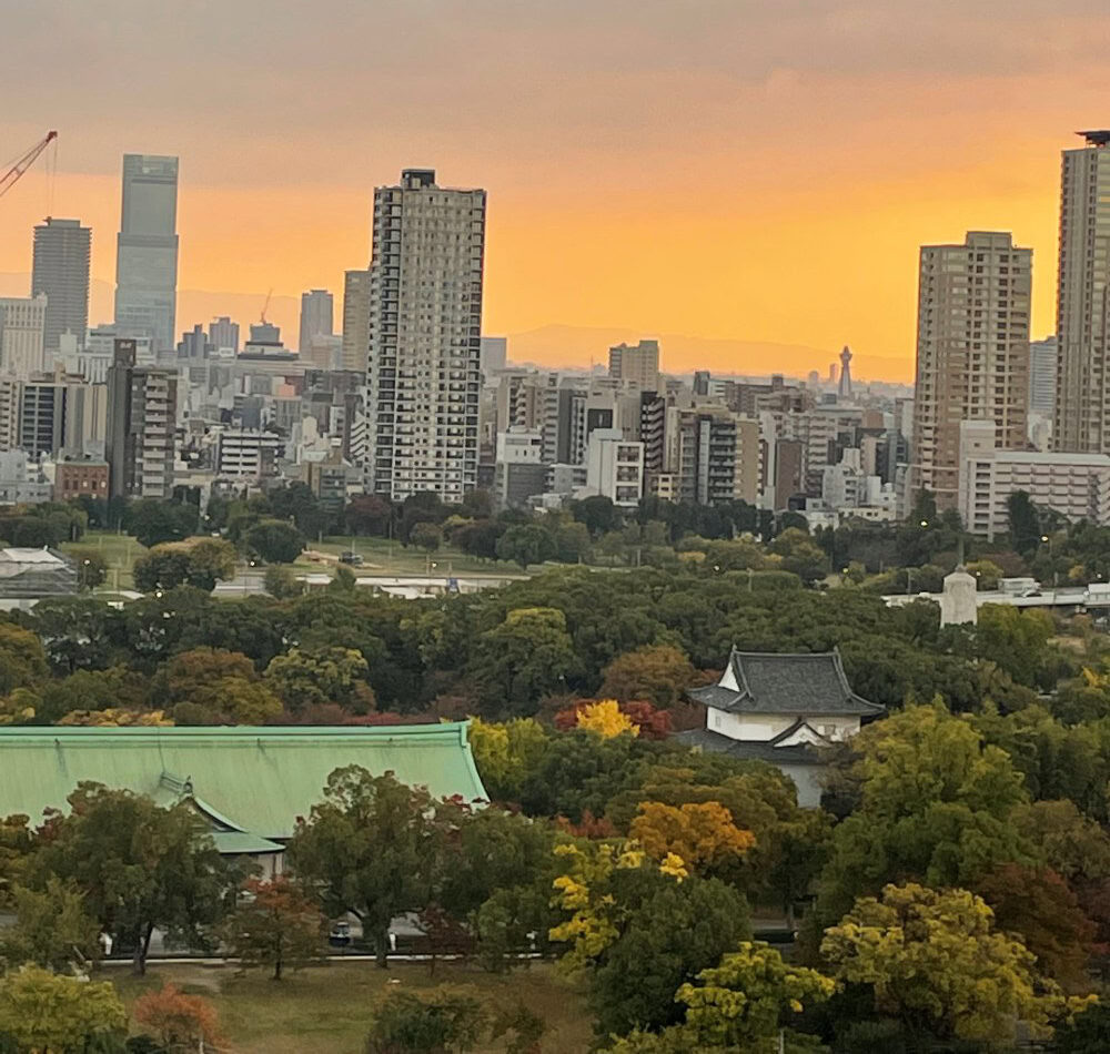 City views from Osaka Castle during sunset.