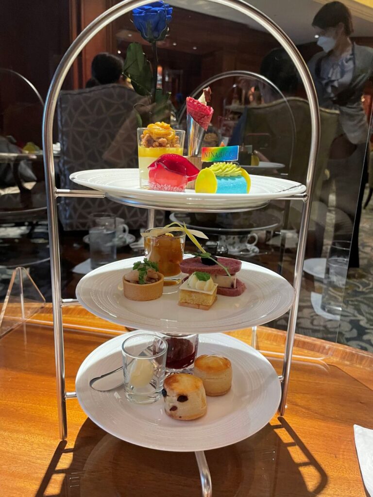 Elegant afternoon tea spread at The Ritz-Carlton Osaka with delicate pastries, desserts, and finger sandwiches