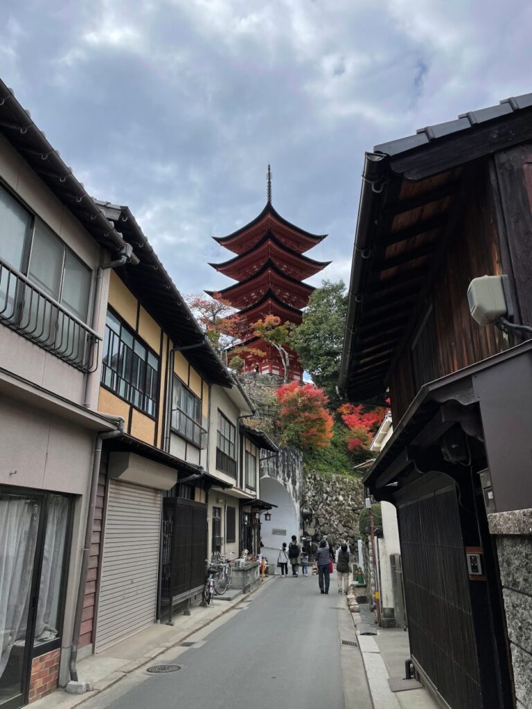 Gojūnotō Pagoda on Miyajima Island, originally built in 1407, featuring elegant five-tiered architecture above the historic town