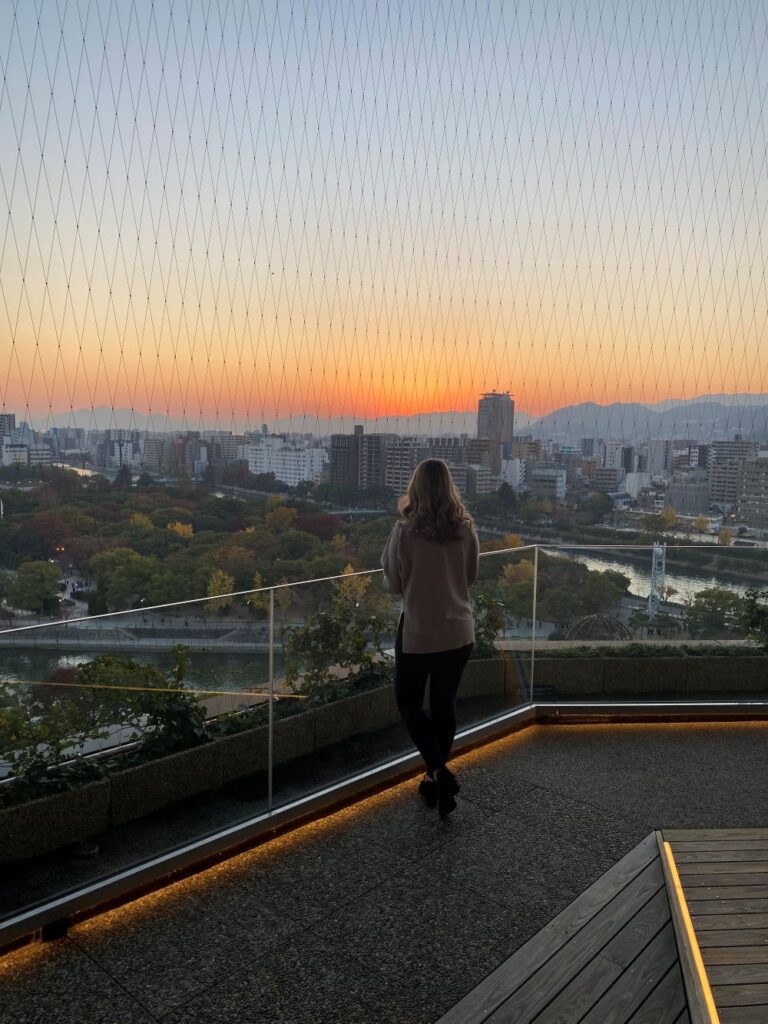 Rooftop view from Orizuru Tower in Hiroshima, Japan, with the city and surrounding mountains
