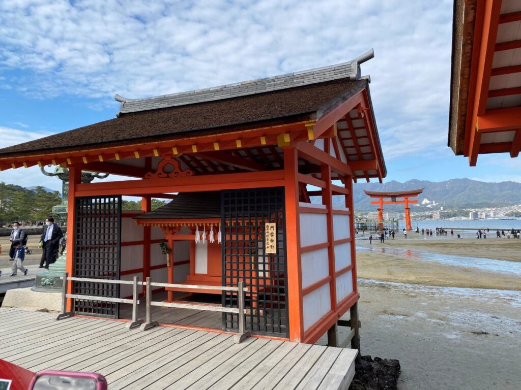 Itsukushima Shrine on Miyajima Island with its famous red torii gate standing in the sea at high tide