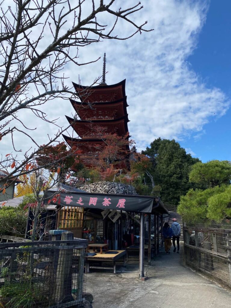 Beautiful Gojūnotō Five-Story Pagoda on Miyajima, Hiroshima, showcasing traditional Japanese architecture and colorful seasonal scenery