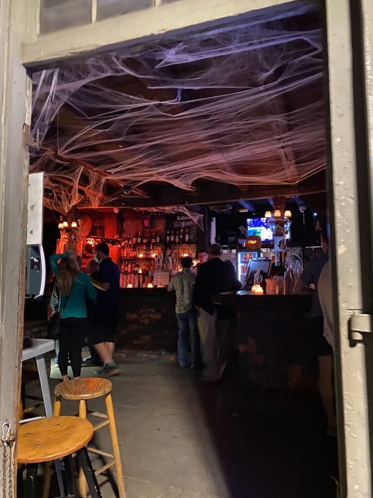 Candlelit Lafitte’s Blacksmith Shop Bar on a two-day haunted New Orleans trip through the atmospheric French Quarter